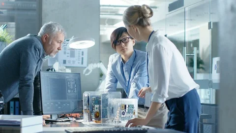 Team of Computer Engineers Choose Printed Circuit Boards to Work with Stock Footage 85771845