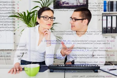 Team Of Computer Programmers Analyzing Code Stock Photos