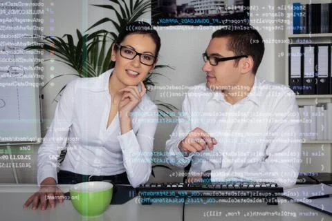 Team Of Computer Programmers Analyzing Code Stock Photos