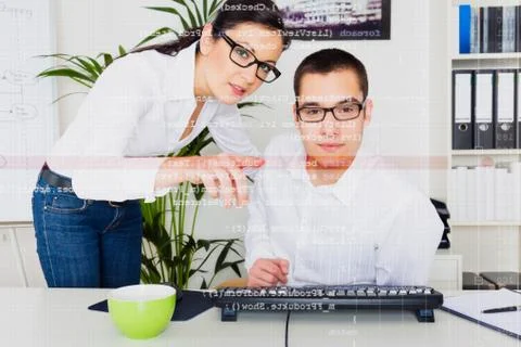 Team Of Computer Programmers Analyzing Code 스톡 사진