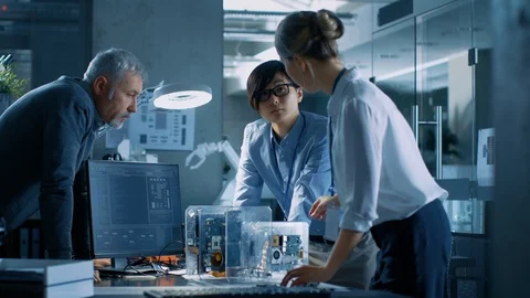 Team of Computer Scientists Choose Between Printed Circuit Board to Integrated Stock Footage 104046704