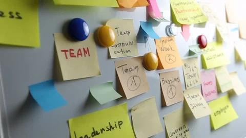 Team concept. Multi-colored sticky paper notes on the wall. Brainstorming concep Stock Footage 121000120