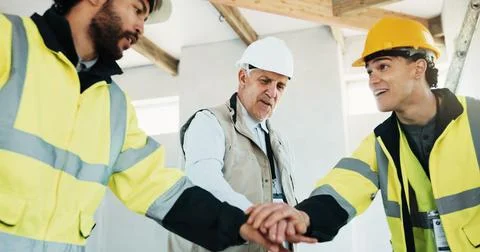 Team, construction and men with hands together at site for motivation, supp.. Stock Photos