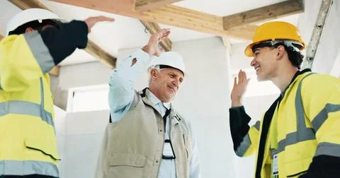 Team, construction and men with high five at site for motivation, support a.. Stock Photos