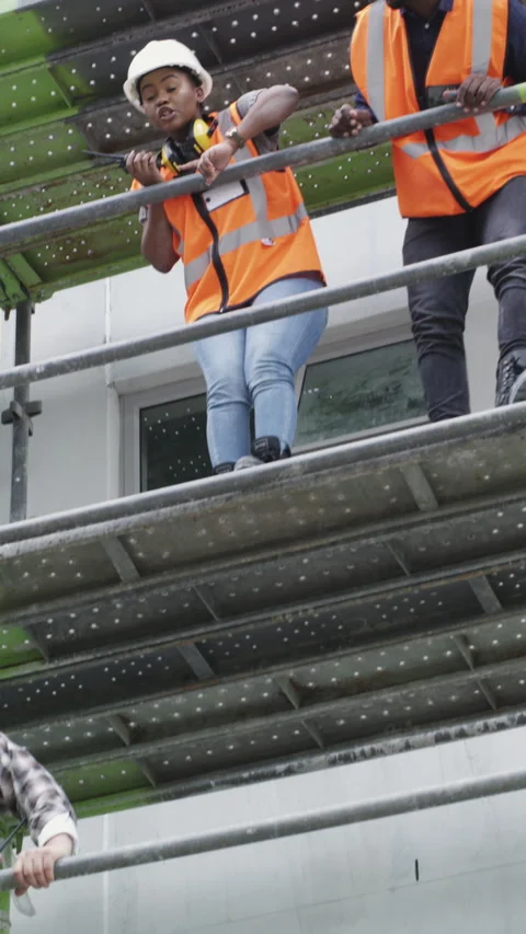 Team, construction and talk with people on site for building, inspection or Stock Footage 327197856