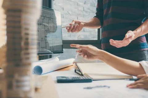 Team of Construction engineering or architect hands working on blueprint insp Stock Photos