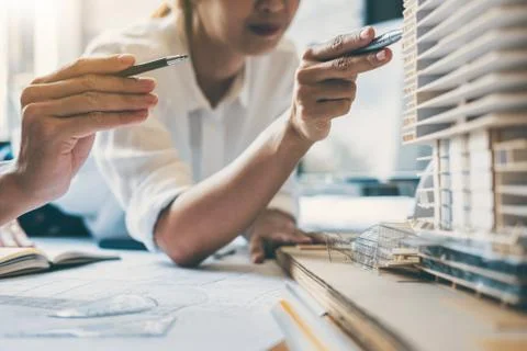 Team of Construction engineering or architect hands working on blueprint insp Stock Photos