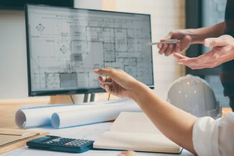 Team of Construction engineering or architect hands working on blueprint insp Foto stock