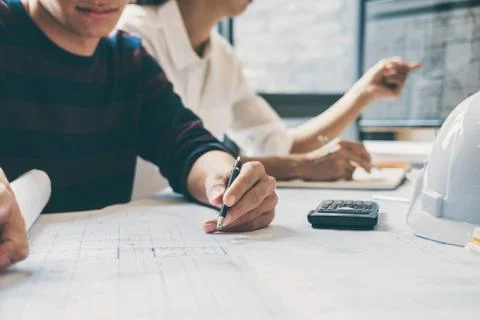 Team of Construction engineering or architect hands working on blueprint insp Stock Photos