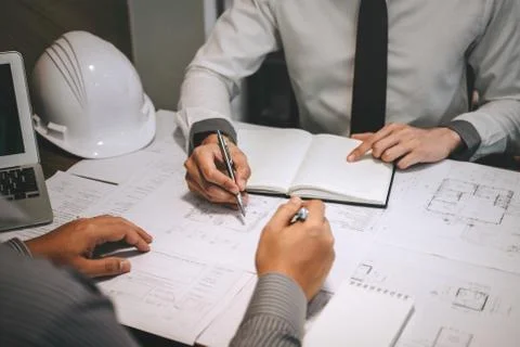 Team of construction engineering or architect partner discuss a blueprint whi Stock Photos