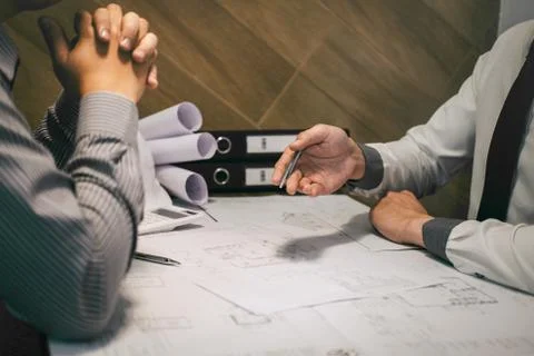 Team of construction engineering or architect partner discuss a blueprint whi Stock Photos
