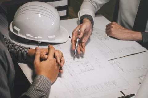 Team of construction engineering or architect partner discuss a blueprint whi Stock Photos