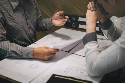 Team of construction engineering or architect partner discuss a blueprint whi Stock Photos