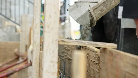 Team of construction workers are working on concreting at construction site. Stock Footage 284708337