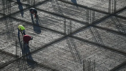 Team of construction workers preparing concrete slabs on a construction site 스톡 동영상 126580234
