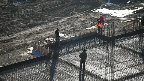 Team of construction workers preparing concrete slabs on a construction site 스톡 동영상 126580266