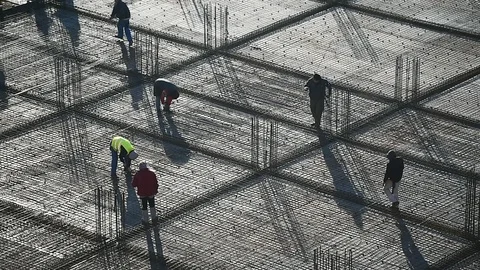 Team of construction workers preparing concrete slabs on a construction site 스톡 동영상 126580317