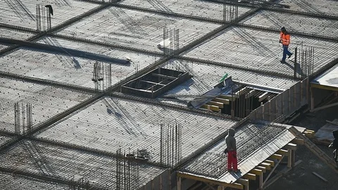 Team of construction workers preparing concrete slabs on a construction site 스톡 동영상 126580398