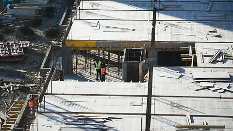 Team of construction workers preparing concrete slabs on a construction site 스톡 동영상 126580403