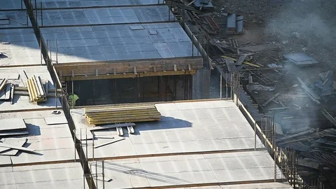 Team of construction workers preparing concrete slabs on a construction site 스톡 동영상 126580489