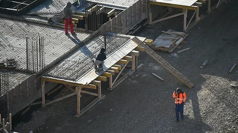 Team of construction workers preparing concrete slabs on a construction site 스톡 동영상 126580588