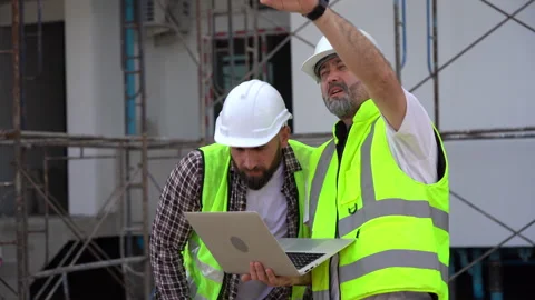 Team of Construction workers Senior architect or civil engineer and foreman.. Stock Footage 262156844