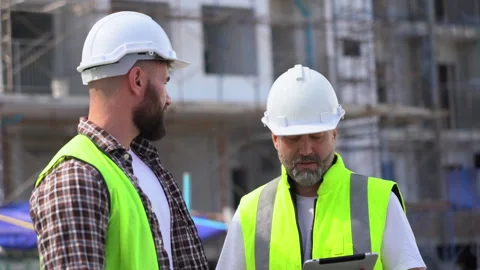 Team of Construction workers Senior architect or civil engineer and foreman.. Stock Footage 262157045