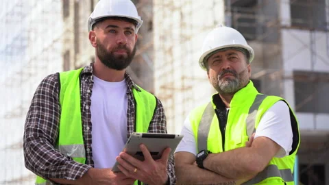 Team of Construction workers Senior architect or civil engineer and foreman.. Stock Footage 262157223