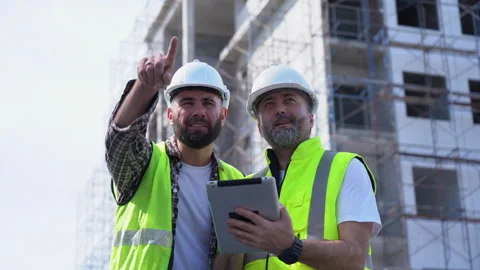Team of Construction workers Senior architect or civil engineer and foreman.. Stock Footage 262158469