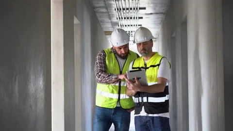 Team of Construction workers Senior architect or civil engineer and foreman.. Stock Footage 262162219