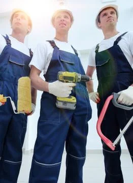 Team of construction workers with working tools Foto stock