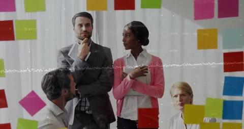 Team converging on sticky notes and developing business plan after pink-cardigan 動画素材 311901274