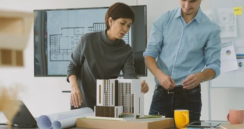 Team of creative architects working together in a architect studio. Stock Footage 91899165