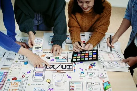 Team of Creative Web, Graphic Designer planning for mobile phone, drawing Stock Photos