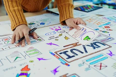 Team of Creative Web, Graphic Designer planning for mobile phone, drawing Stock Photos