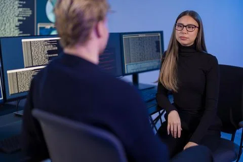 Team of cybersecurity professionals collaborating in a technology operations Stock Photos