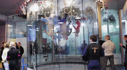 Team dance inside fly station. Simulator skydiving. Contest. Challenge. Tricks Stock Footage 67557916