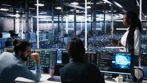 Team of data center developers doing brainstorming, monitoring neural network AI Stock Footage 313640185