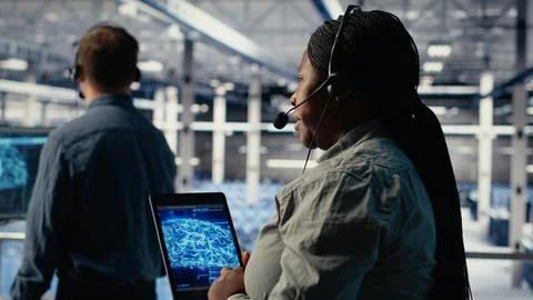 Team of data center programmers using AI to help customers Stock Photos