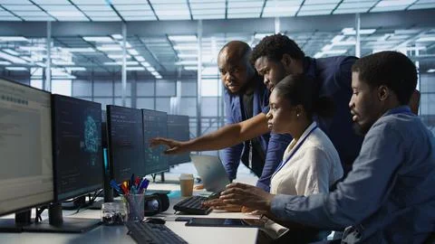 Team of data center technicians maintaining company network infrastructure Stock Photos