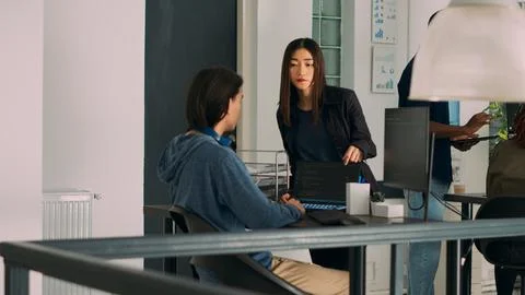 Team of database admins analyzing source code on computer monitor 스톡 사진