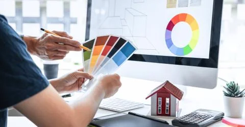 Team design of young Interior graphic designer working house project sketchin Stock Photos