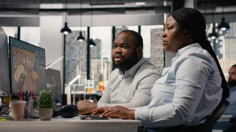Team of designers developing digital 3D architecture model with virtual assets Stock Photos