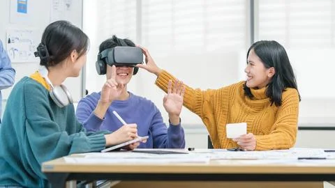 Team of developer discussing new ideas to improve the visual experience, wo.. Stock Photos