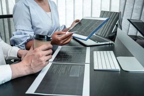Team of Developer programmer working on coding program software computer in o Stock Photos