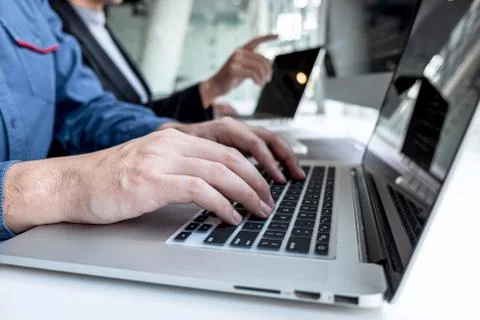 Team of developer programmer working on project in software development compu Stock-Fotos