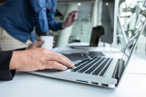 Team of developer programmer working on project in software development compu Stock Photos