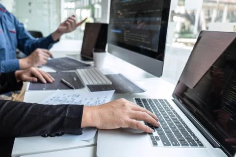 Team of developer programmer working on project in software development compu Stock-Fotos