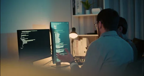 Team of Developers Coding Together at Night in Tech Office. Stock Footage 306739368