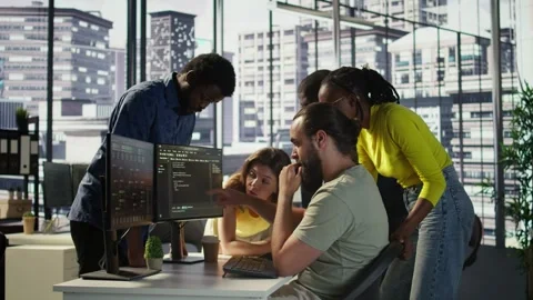 Team of developers doing brainstorming, optimizing code Stock Footage 318163260